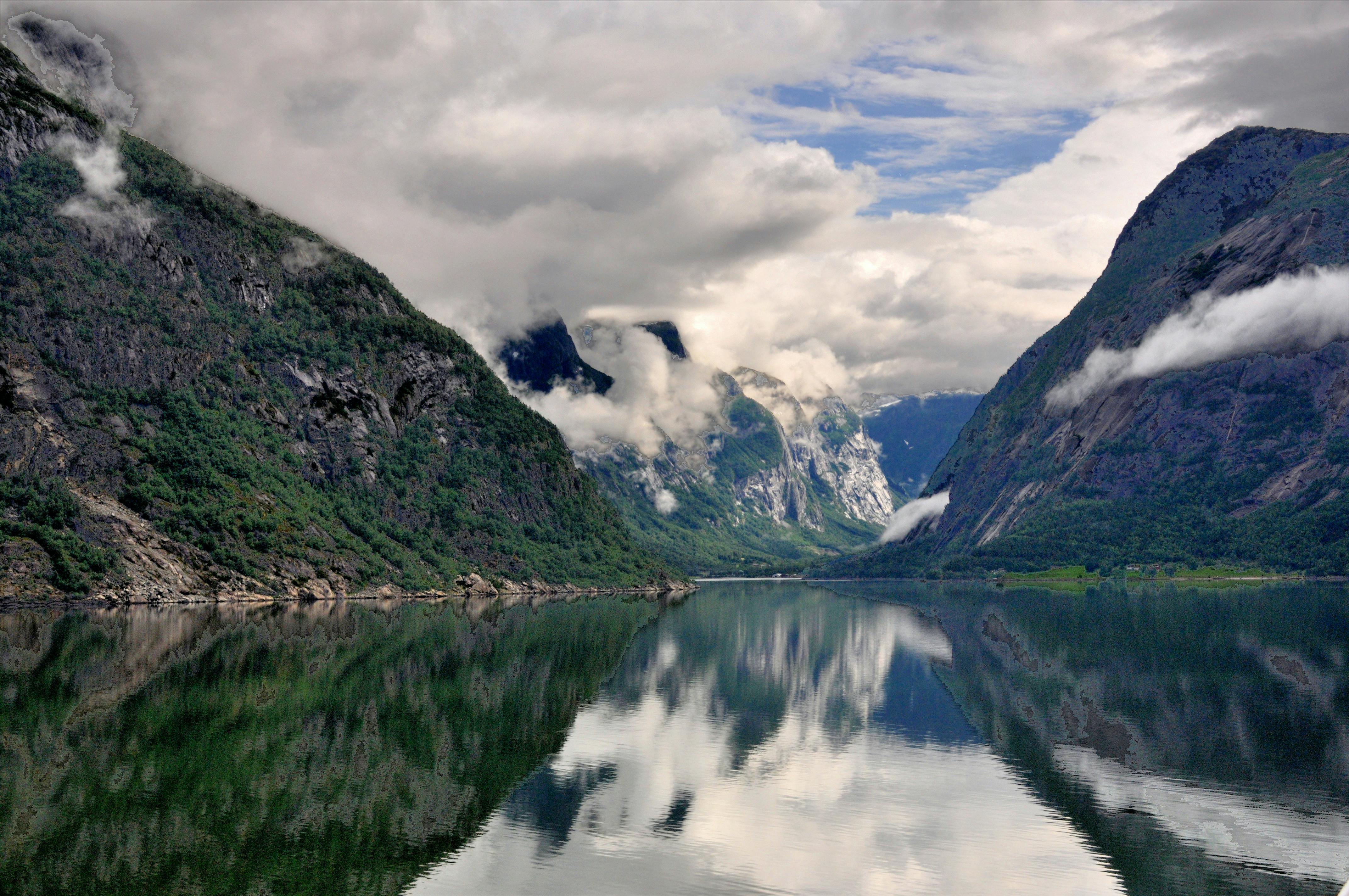 Mountain fjord with cloud reflections